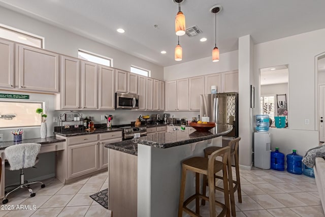 14806 E Crested Crown, Fountain Hills, AZ 85268 - kitchen with appliances with stainless steel finishes, light tile patterned floors, a breakfast bar, recessed lighting, and dark stone counters