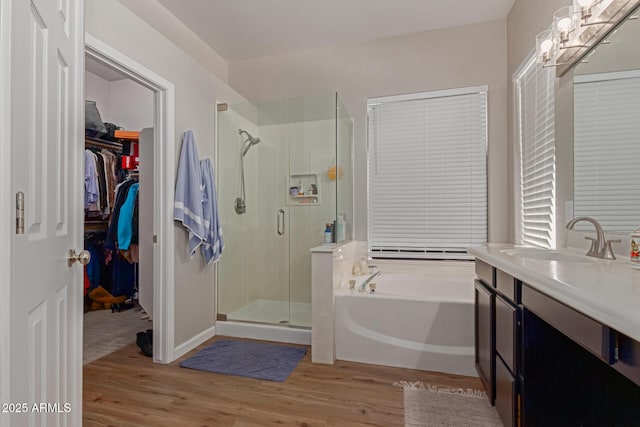 14806 E Crested Crown, Fountain Hills, AZ 85268 - full bathroom with a stall shower, wood finished floors, a garden tub, and vanity