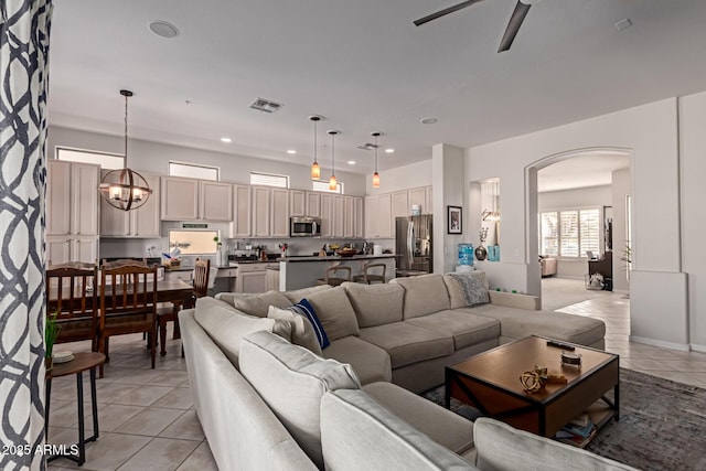 14806 E Crested Crown, Fountain Hills, AZ 85268 - living area featuring arched walkways, light tile patterned floors, ceiling fan, and recessed lighting