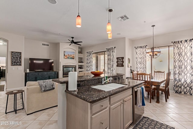 14806 E Crested Crown, Fountain Hills, AZ 85268 - kitchen with light tile patterned flooring, ceiling fan, a center island with sink, and stainless steel dishwasher