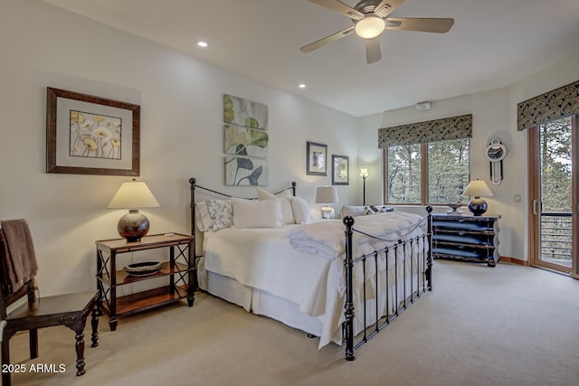 bedroom featuring access to exterior, multiple windows, light colored carpet, and recessed lighting