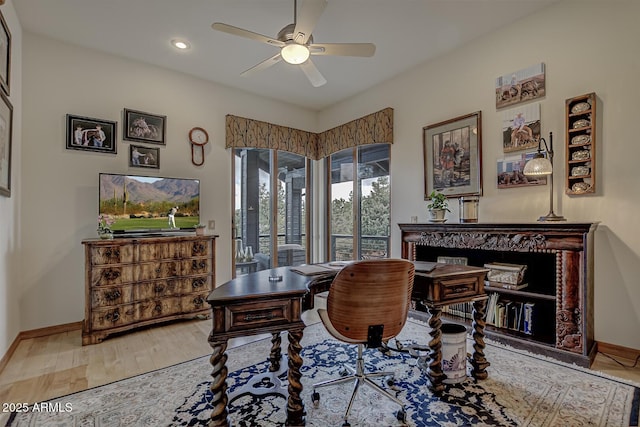 interior space with recessed lighting, baseboards, wood finished floors, and a ceiling fan