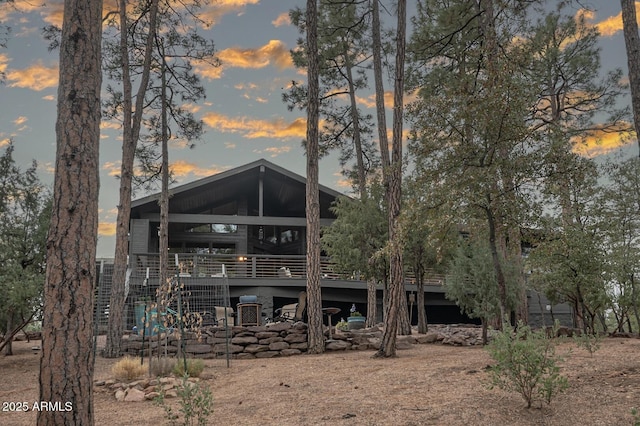 view of back of property at dusk