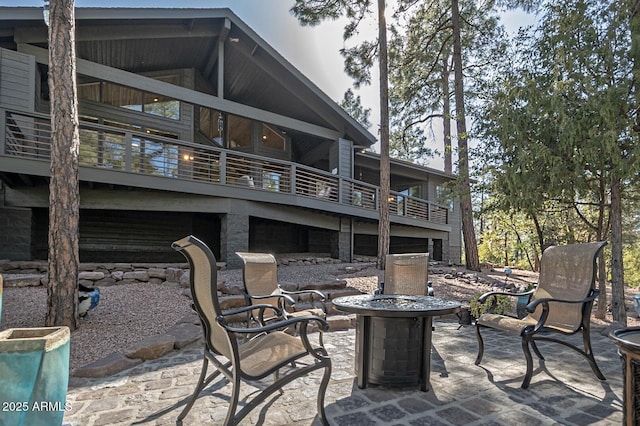 view of patio / terrace featuring an outdoor fire pit