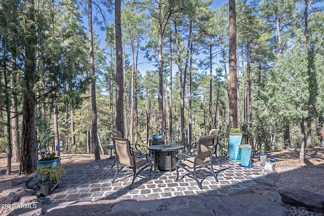 view of patio featuring an outdoor fire pit