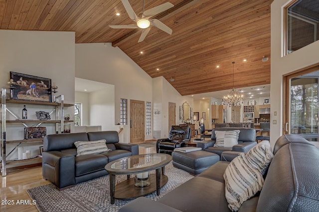 living area with ceiling fan with notable chandelier, wood ceiling, light wood-style floors, and high vaulted ceiling