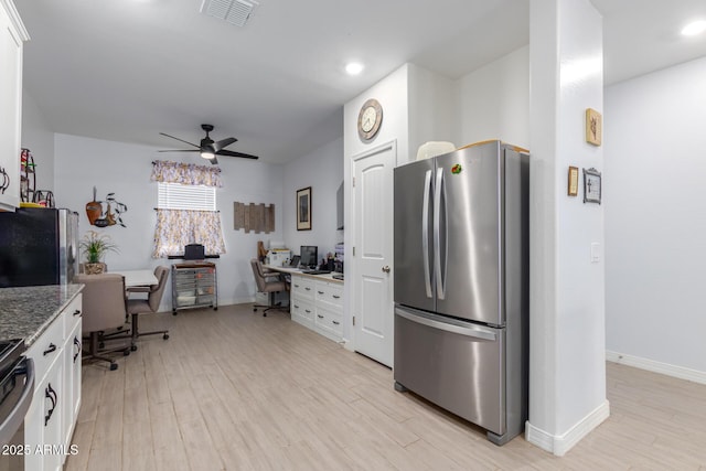 1463 W Pinkley Ave, Coolidge, AZ 85128 - kitchen with freestanding refrigerator, white cabinetry, and recessed lighting
