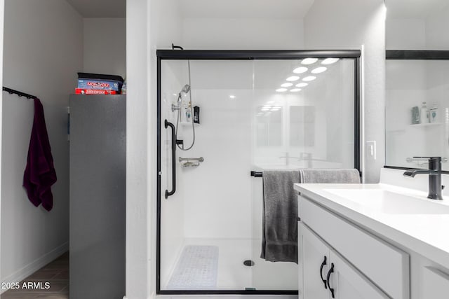 1463 W Pinkley Ave, Coolidge, AZ 85128 - bathroom with vanity, a shower stall, and baseboards