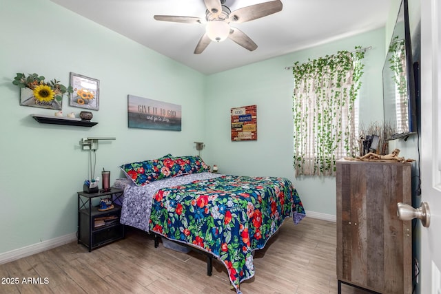 1463 W Pinkley Ave, Coolidge, AZ 85128 - bedroom featuring wood finished floors, baseboards, and a ceiling fan
