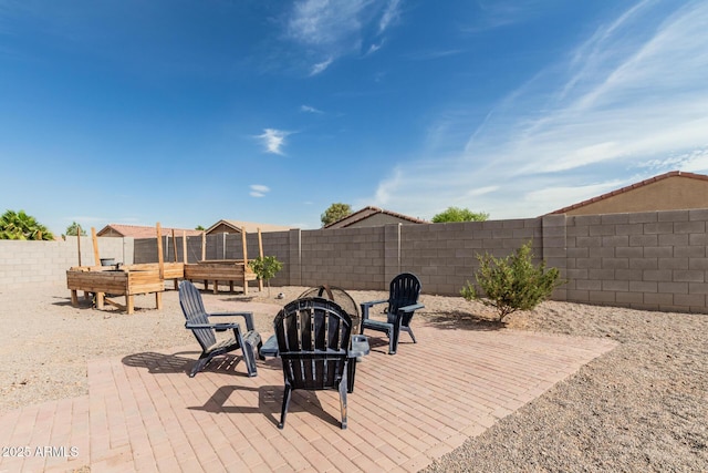 1463 W Pinkley Ave, Coolidge, AZ 85128 - wooden terrace featuring a fenced backyard and an outdoor fire pit