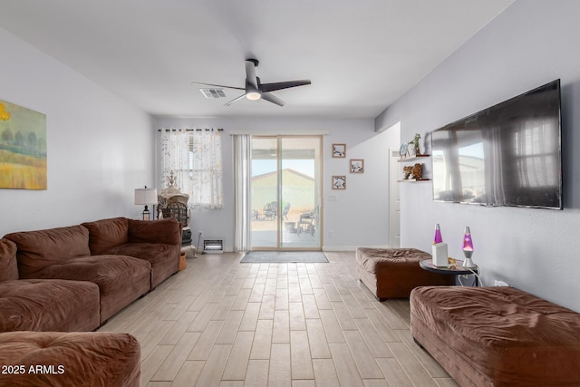 1463 W Pinkley Ave, Coolidge, AZ 85128 - living room with a ceiling fan and light wood-style flooring
