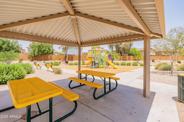 1463 W Pinkley Ave, Coolidge, AZ 85128 - fenced backyard with a playground and a patio area