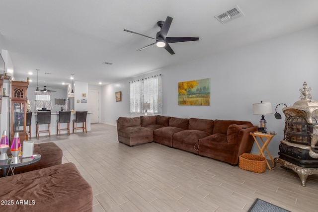 1463 W Pinkley Ave, Coolidge, AZ 85128 - living area with a ceiling fan and light wood-type flooring