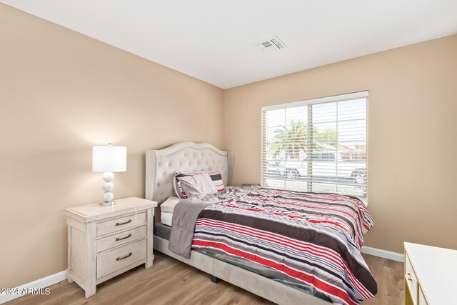 bedroom with light wood-type flooring