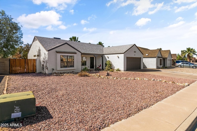 19039 N 47th Ave, Glendale, AZ 85308 - view of front of home featuring stucco siding, driveway, fence, a gate, and a garage