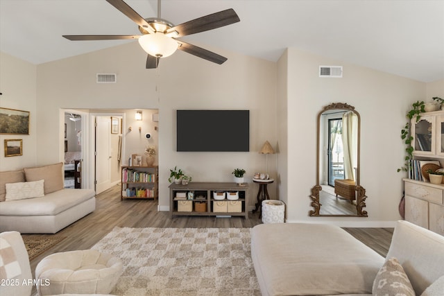 19039 N 47th Ave, Glendale, AZ 85308 - living area with wood finished floors, high vaulted ceiling, a ceiling fan, and baseboards