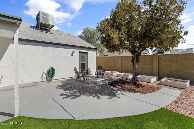 19039 N 47th Ave, Glendale, AZ 85308 - view of patio / terrace with central AC and a vegetable garden