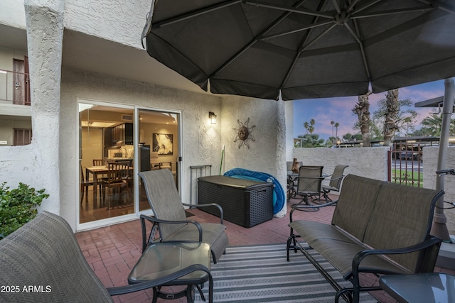 view of patio featuring fence