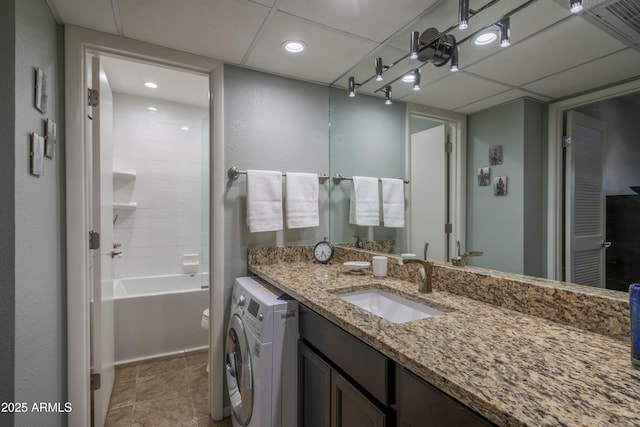 full bath featuring tile patterned flooring, washtub / shower combination, vanity, recessed lighting, and washer / clothes dryer