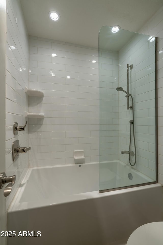 bathroom featuring toilet, recessed lighting, and shower / bath combination