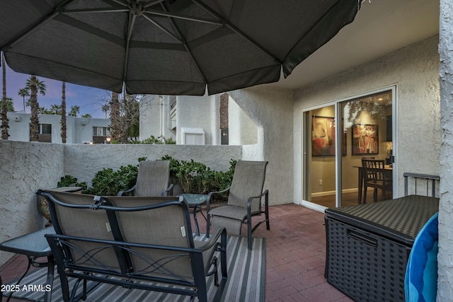 view of patio / terrace with outdoor dining space and fence