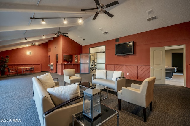 living room featuring visible vents, carpet, lofted ceiling, a textured ceiling, and a ceiling fan