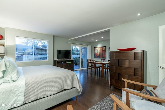 bedroom with recessed lighting, wood finished floors, and access to outside