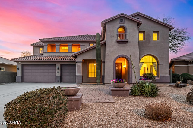 mediterranean / spanish-style house featuring a garage