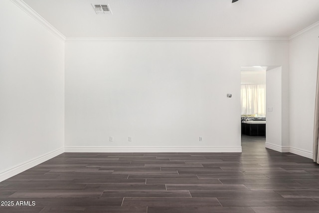 unfurnished room with crown molding and dark hardwood / wood-style floors