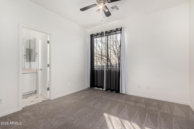 carpeted empty room with ceiling fan