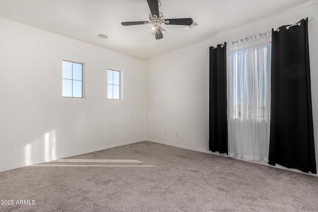 carpeted empty room with ceiling fan