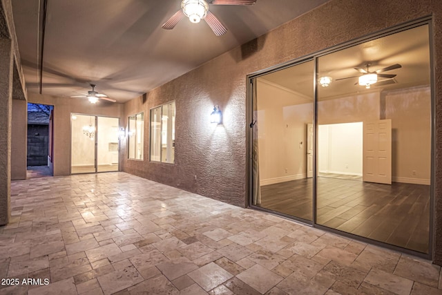 unfurnished room featuring ceiling fan