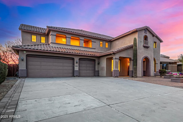 mediterranean / spanish house with a garage