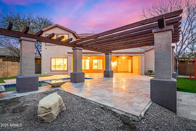 patio terrace at dusk with a pergola