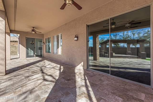 view of patio featuring ceiling fan