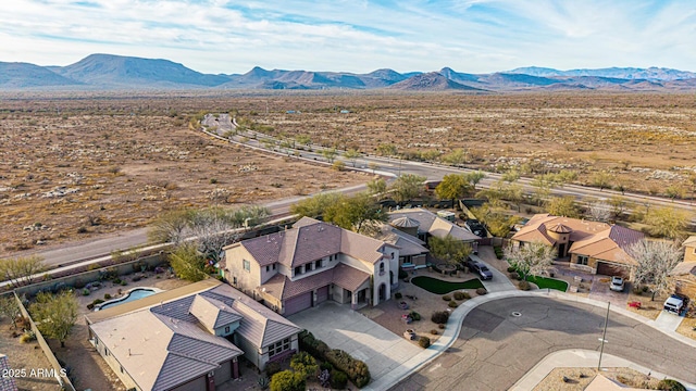 birds eye view of property featuring a mountain view