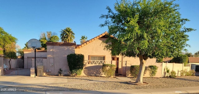 5323 W N Ln, Glendale, AZ 85302 - mediterranean / spanish house with a gate, a fenced front yard, and stucco siding