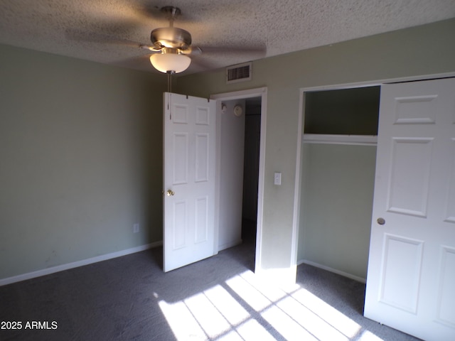 5323 W N Ln, Glendale, AZ 85302 - unfurnished bedroom with carpet, a textured ceiling, a closet, and a ceiling fan