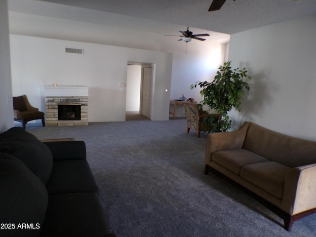 5323 W N Ln, Glendale, AZ 85302 - living area with carpet floors, a ceiling fan, and a stone fireplace
