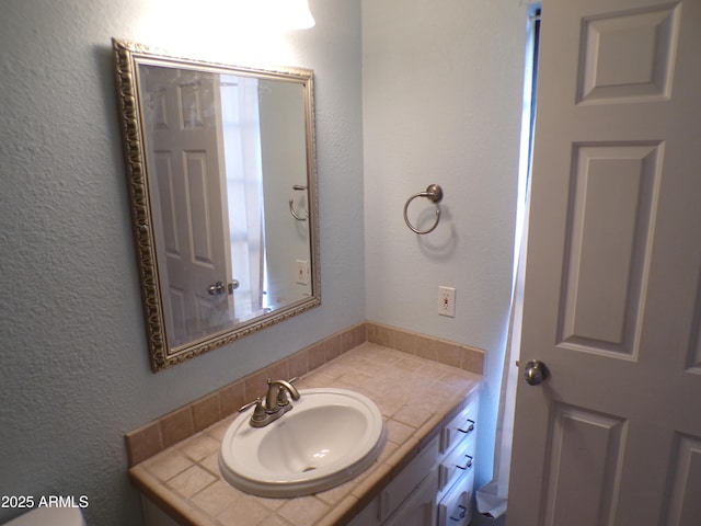 5323 W N Ln, Glendale, AZ 85302 - bathroom with vanity and a textured wall