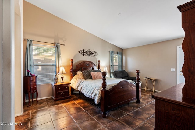 bedroom with lofted ceiling