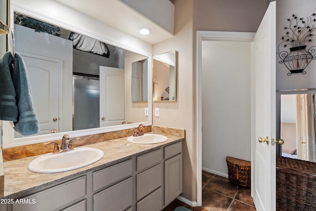 bathroom with tile patterned flooring and vanity