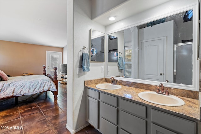 bathroom featuring tile patterned flooring, vanity, and a shower with door