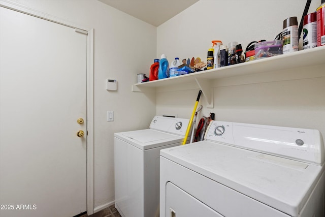 clothes washing area featuring washer and clothes dryer