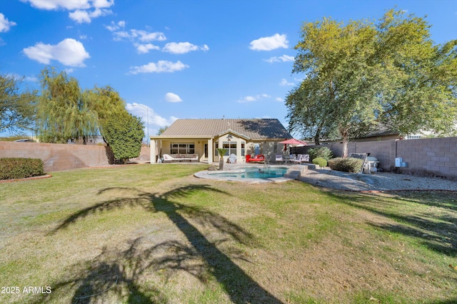 view of yard with a fenced in pool and a patio area