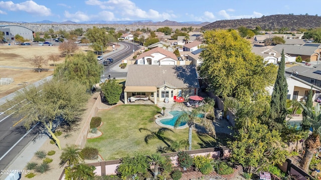 birds eye view of property featuring a mountain view