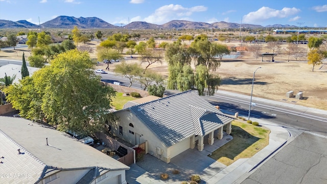 birds eye view of property featuring a mountain view