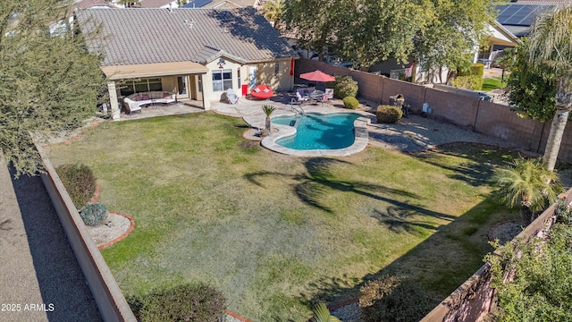 view of pool featuring a patio and a lawn