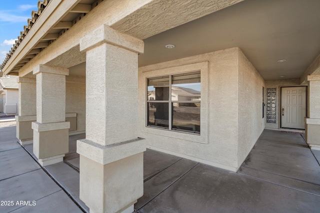 entrance to property with a patio area