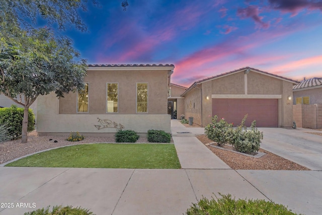 22927 E Via Del Oro, Queen Creek, AZ 85142 - mediterranean / spanish-style home with stucco siding, driveway, a tile roof, a garage, and a front lawn
